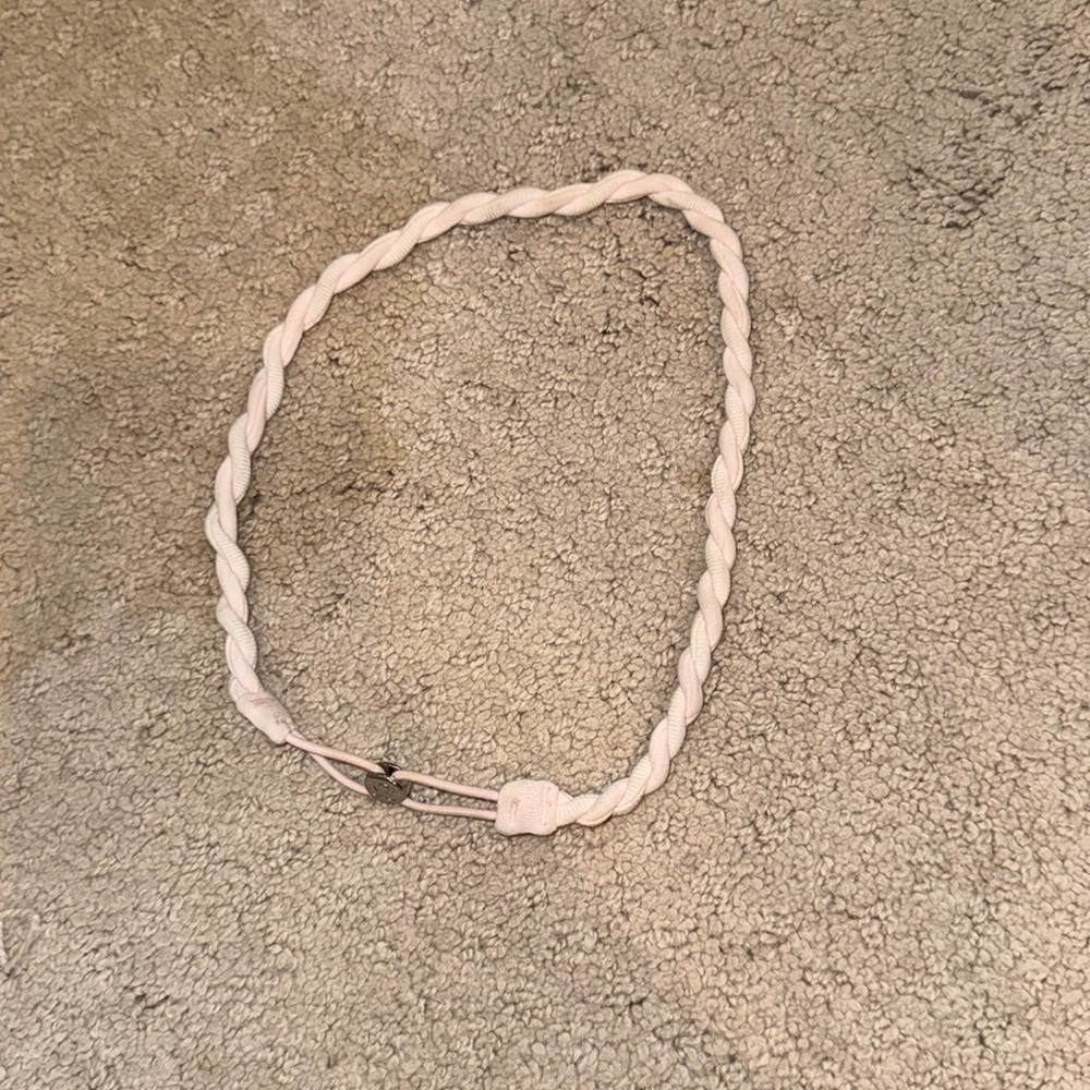 Lululemon twist headband in light pink. Discontinued style